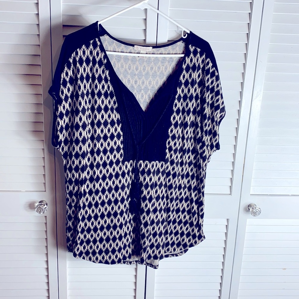 Beautiful black and white top with tassels.